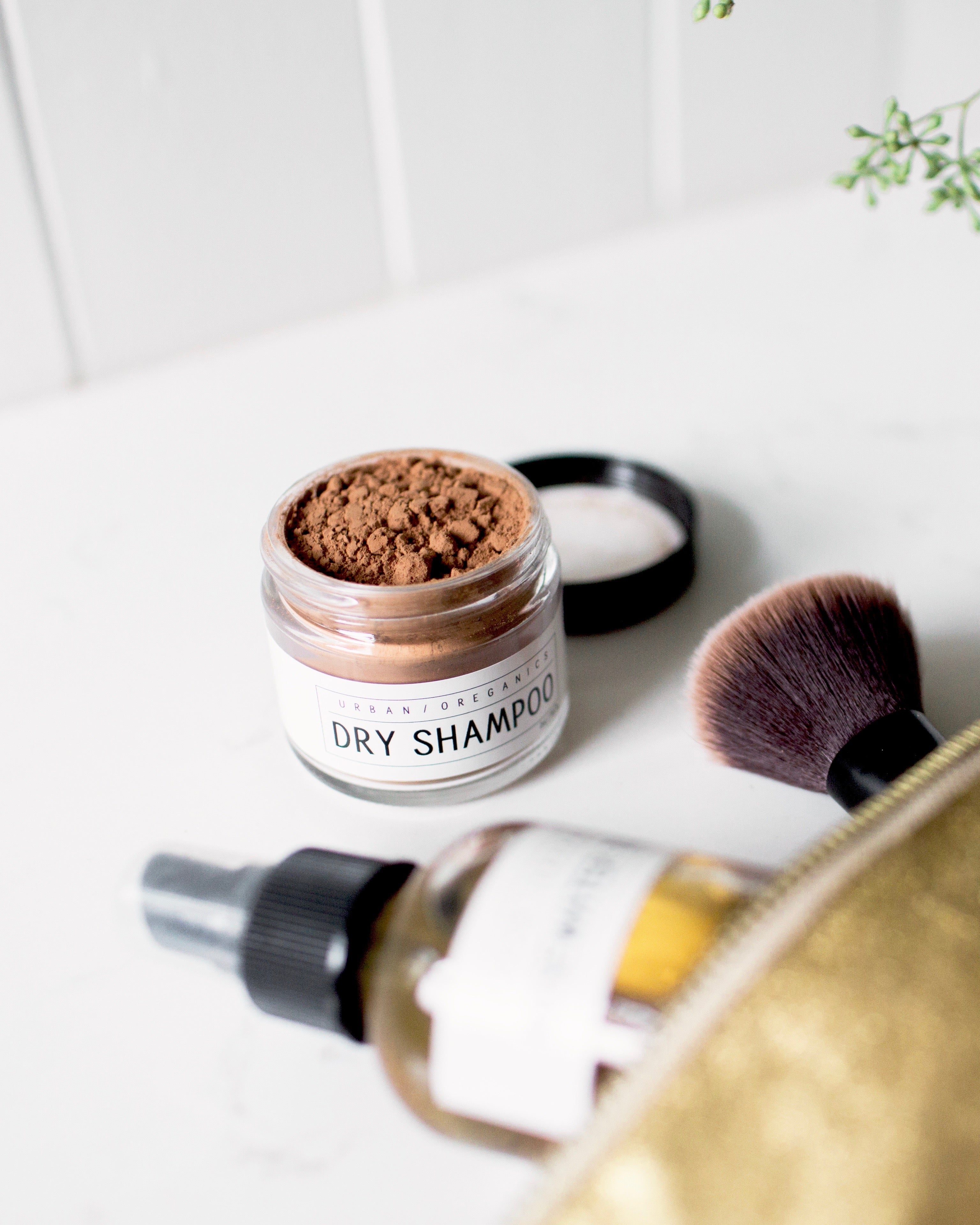 Jar of brunette dry shampoo on bathroom counter