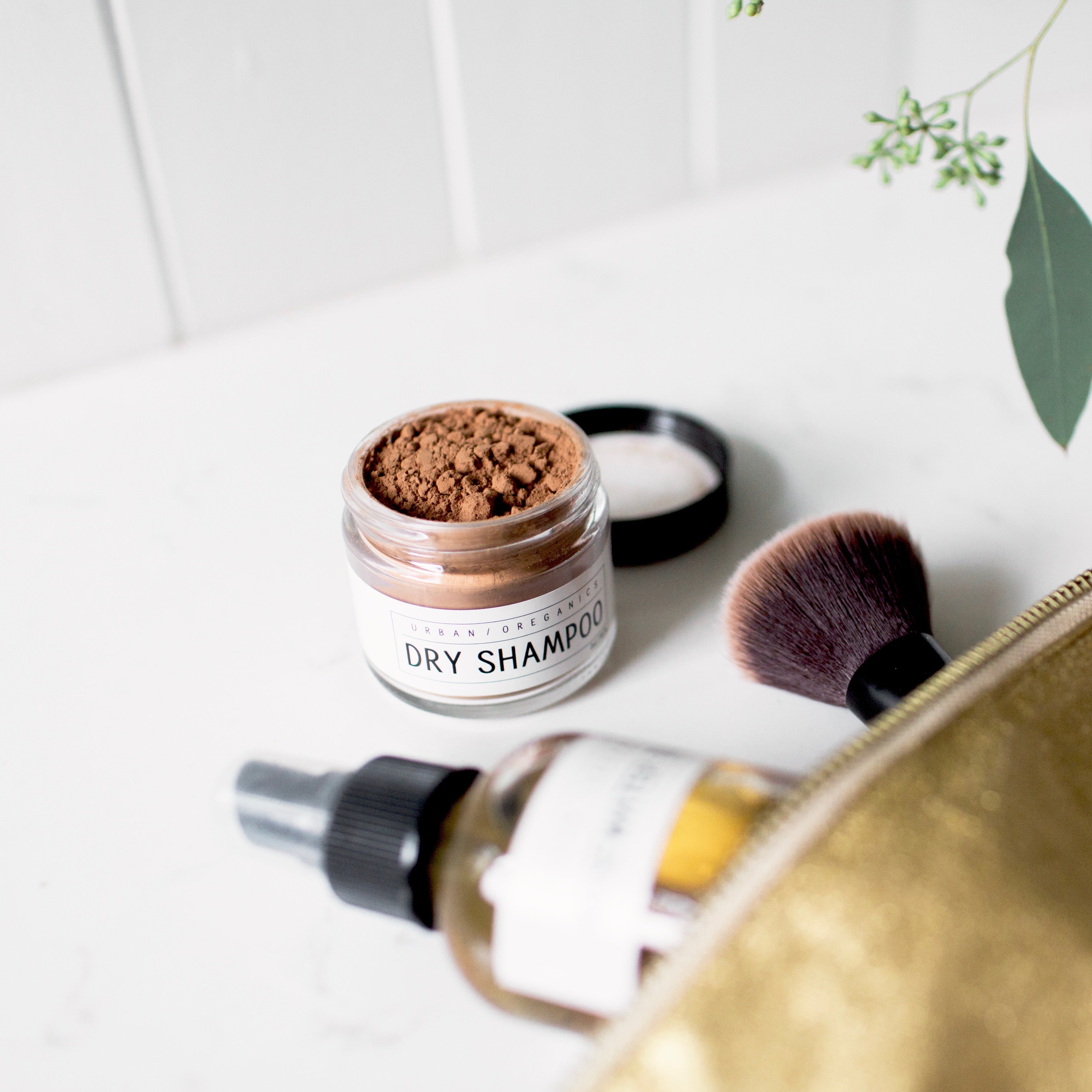 Jar of brunette dry shampoo on bathroom counter
