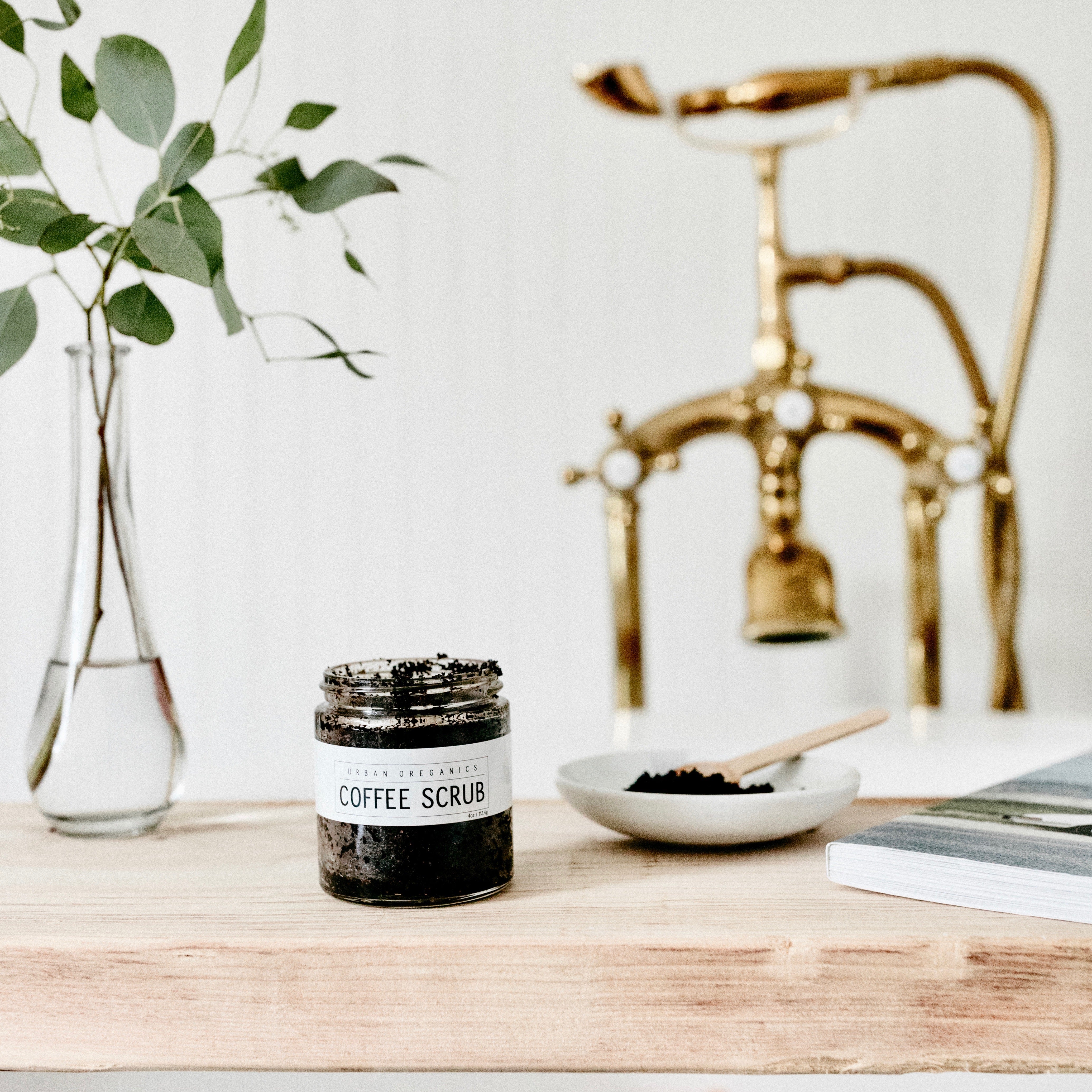 Coffee scrub in glass jar, on tub tray